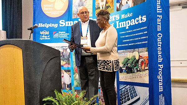 Honoring award winner at annual small farm conference.