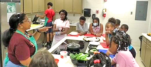 Youth cooking in the kitchen.