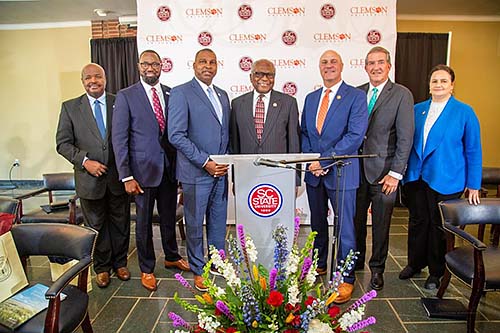 South Carolina State and Clemson University representatives pose with federal dignitaries.