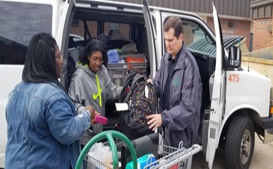 Participants receive supplies at the 4-H hurricane school drive.