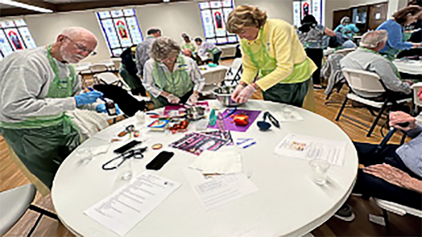 Members of the community preparing heart healthy diet.