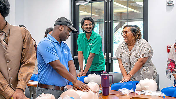 Participants perform CPR.