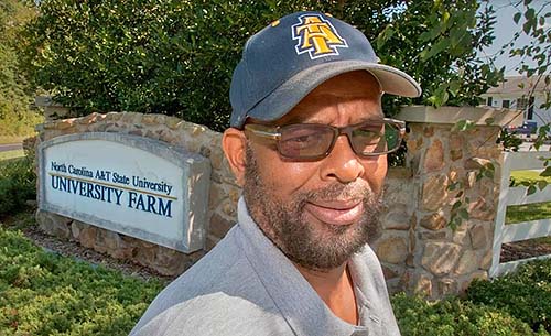Leon Moses takes a break from a busy day at North Carolina A&T’s University Farm.
