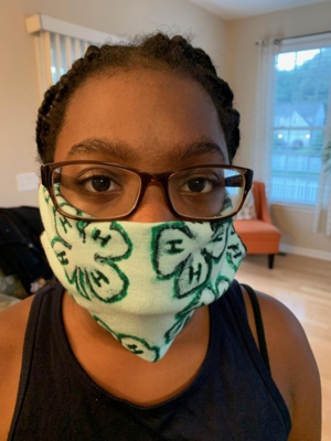 Tiana Holmes designed her cloth mask that sports the 4-H clover.