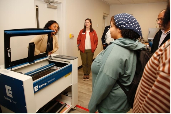 Heaven Whitby leads a tour for students and educators on the Warner Robins campus.