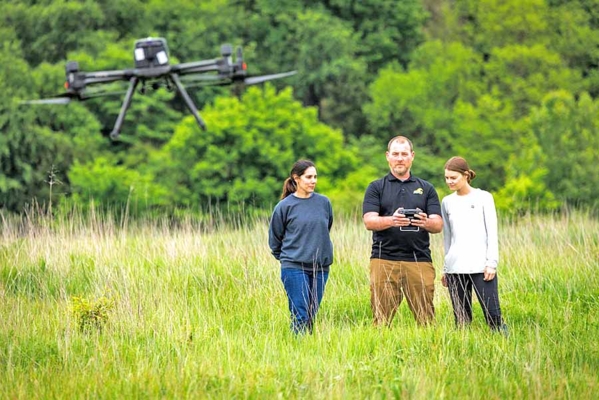 Kentucky State employees fly a drone in Frankfort, Kentucky.