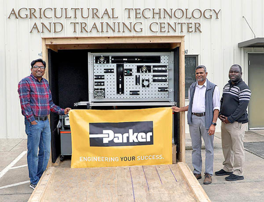 Agricultural engineering program faculty, Dr. Md. Abdul Momin, Dr. Anura Rathnayake and Dr. Blessing Masasi, inspect the hydraulic trainer.