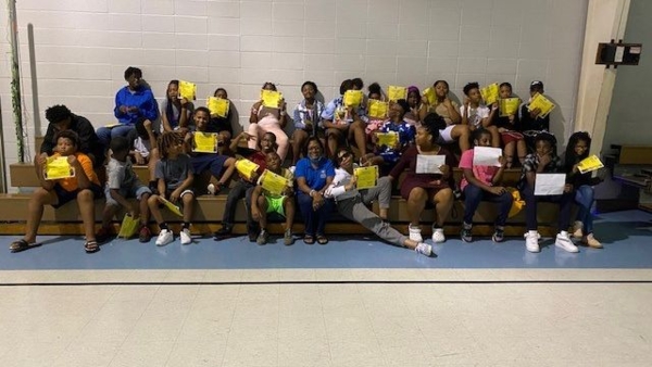 Boys and Girls Club participants display their certificates at the completion of a summer C.H.E.F. camp.