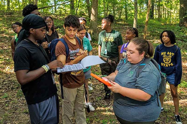 Kaitlynn Gootee collects data with students at the Environmental Education and Research Center.
