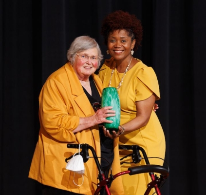 Dr. Marion Simon and Acting President Clara Stamps pose after Simon receives the Agricultural Heritage Award at the Heritage Assembly.