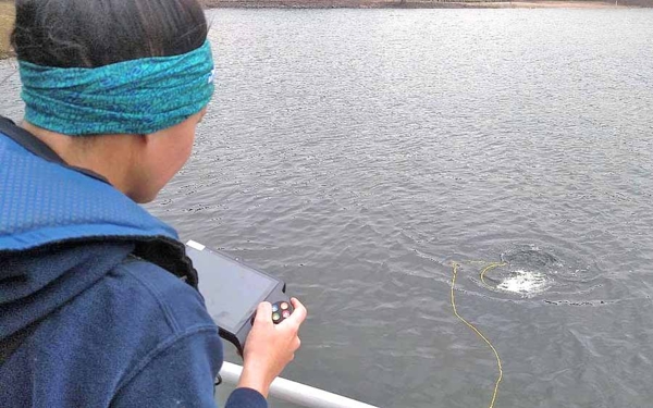 UAPB graduate student pilots a submersible drone at DeGray Lake.