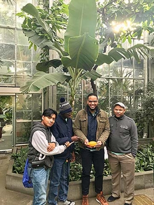 4-H’ers Joshua Puac-Puac and Qudre Joyner, 4-H Agent Guy Holly (with cacao pod) and 4-H Agriscience Associate Kurt Taylor at the U.S. Botanical Garden in January 2020.