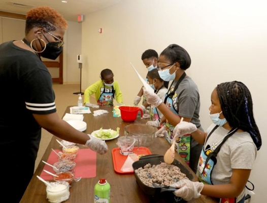 Children learn basic cooking skills and how to eat new and healthy foods.