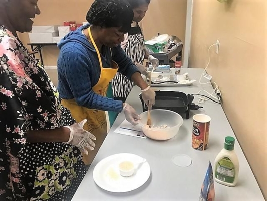 Marilyn Burch, Extension associate-foods and nutrition, conducts a cooking class in which she emphasizes safe food handling techniques.