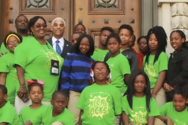 Sherry Maxwell poses with youth in front of the Missouri State Supreme Court building during an April 2017 trip to Jefferson City, Missouri.