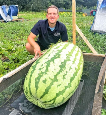 Brandon Huber with a giant watermelon.