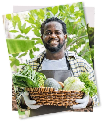 Man holding a basket full of vegetables.