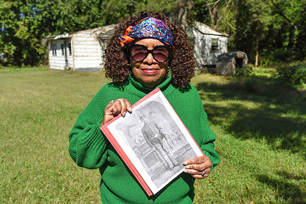 Deborah Scott holds the only known picture of her grandfather, Thomas E. Polk Sr., in uniform.
